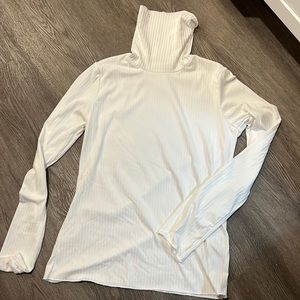 White, lightweight turtleneck. Size large, but runs a little small.